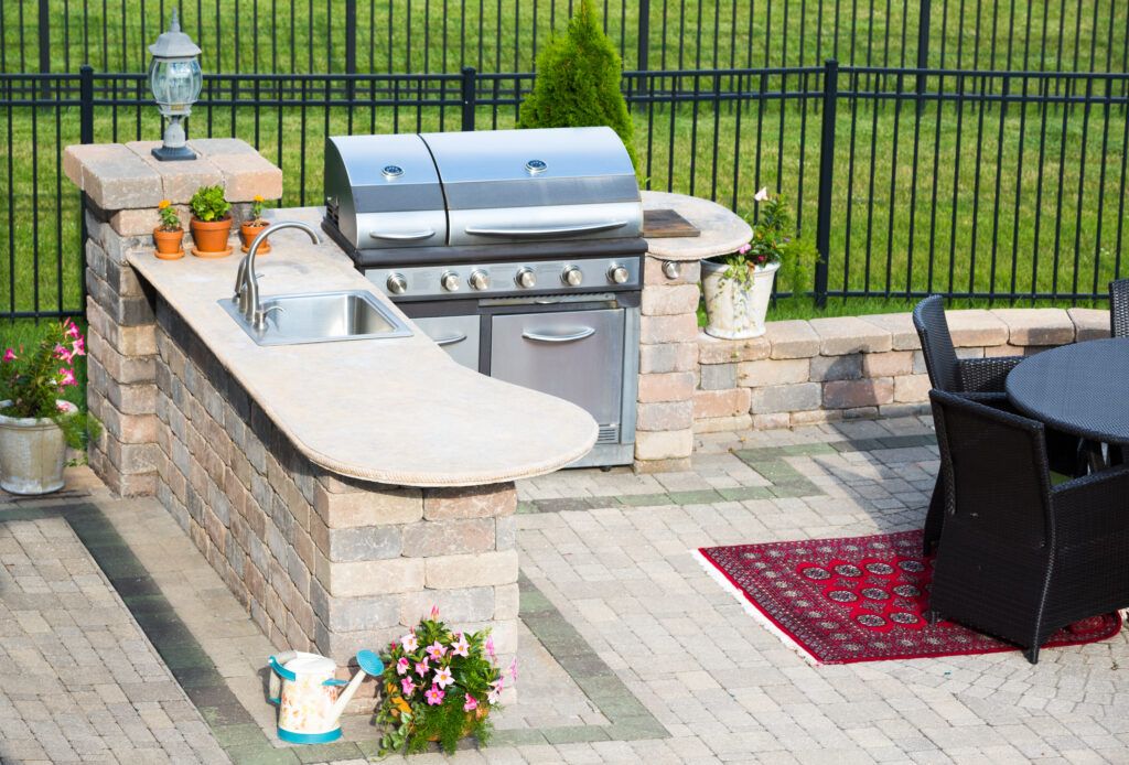 Picture of an outdoor kitchen with table and chairs