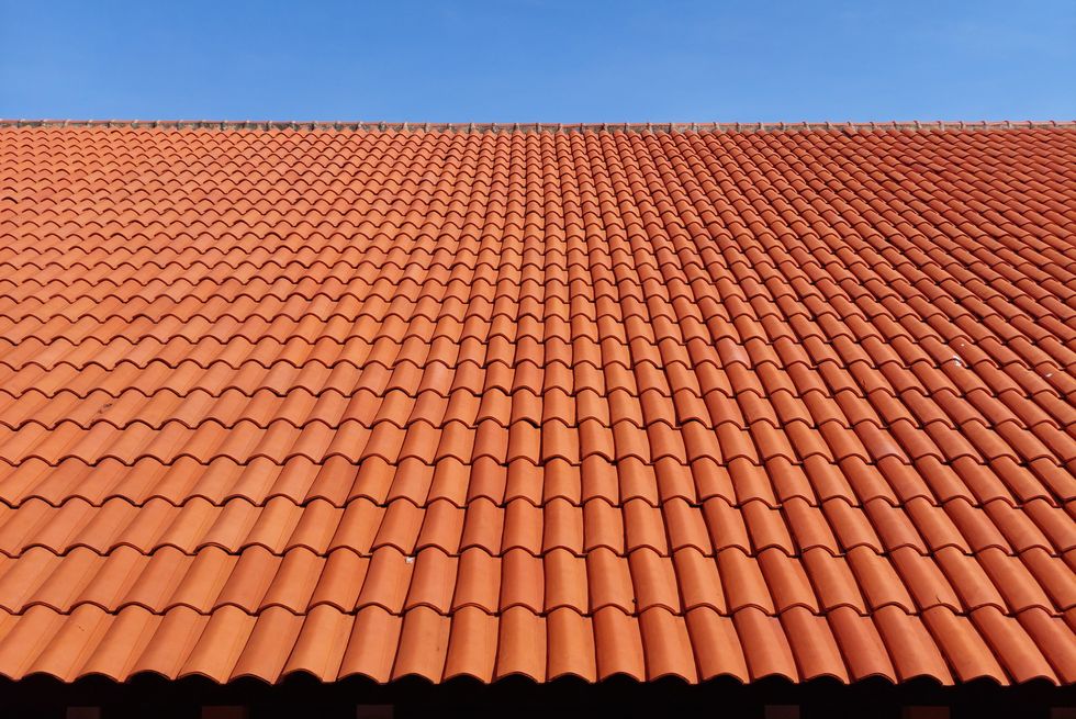 roof of building with clay tiles against clear sky