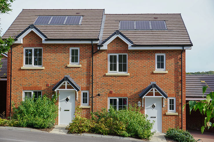 Picture of two homes with built in solar panels