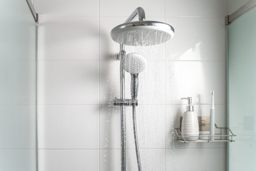 Picture of a shower head with water flowing out