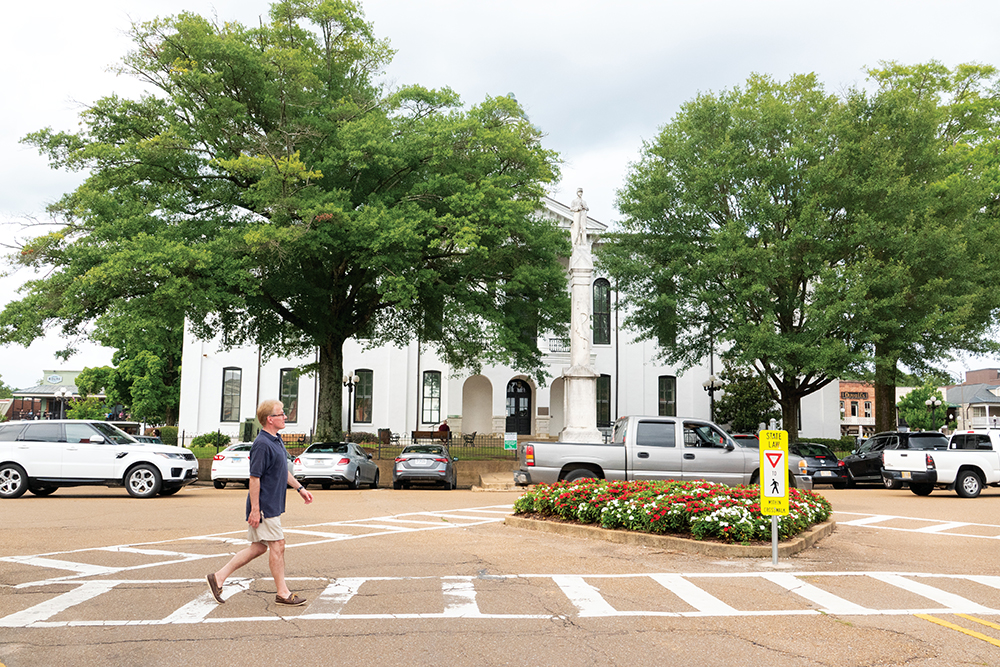 Scenes from Oxford, Mississippi - A man walking through the downtown square.