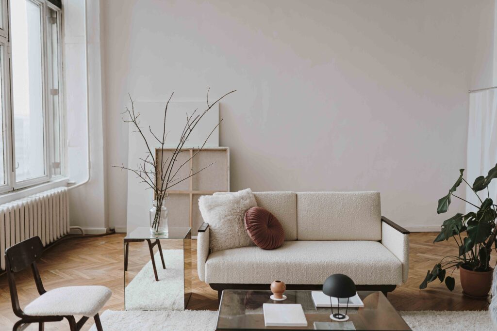 Picture of a living room in hygge minimalistic style with white sofa and coffee table