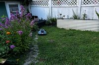 The MAMMOTION YUKA mini (H Version) Perimeter Wire-Free Robot Lawn Mower is used to mow a lawn