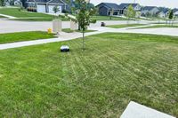 The ANTHBOT Genie 3000 Smart AI Robot Lawn Mower mows a lawn