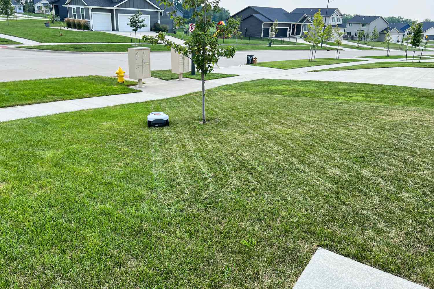 The ANTHBOT Genie 3000 Smart AI Robot Lawn Mower mows a lawn