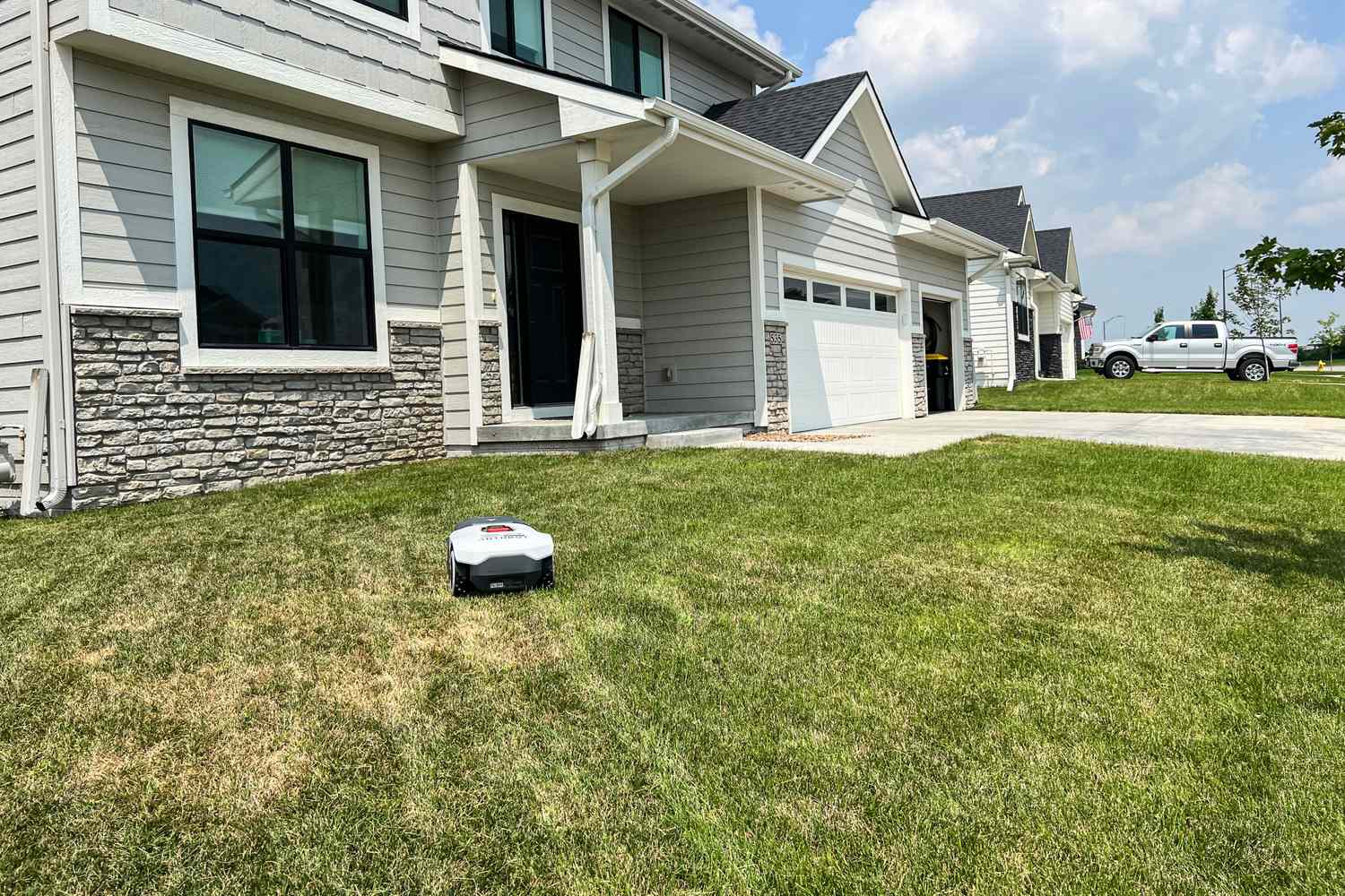 The ANTHBOT Genie 3000 Smart AI Robot Lawn Mower mows a lawn