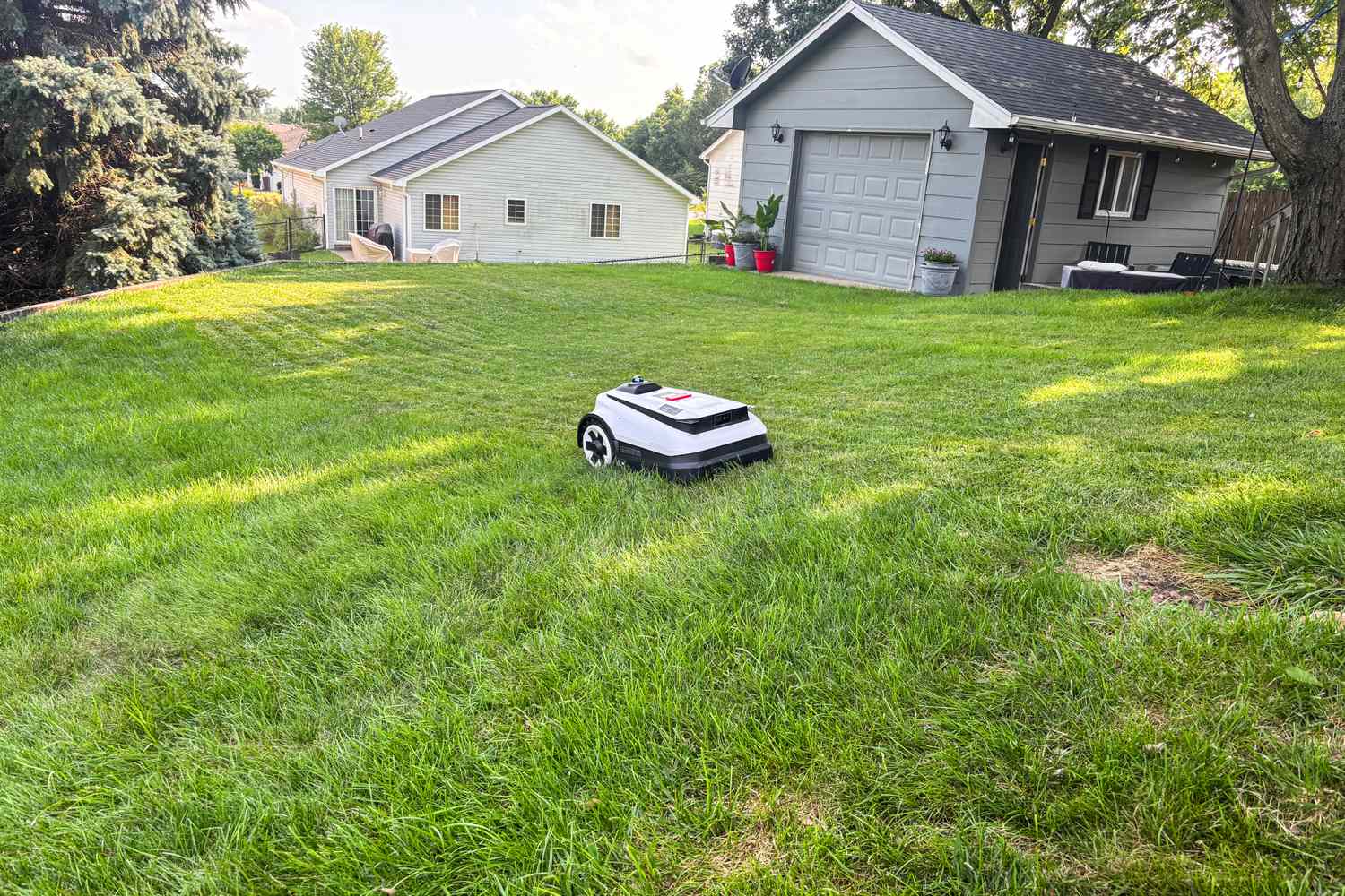 The Ecovacs Goat A3000 LiDAR Robot Lawn Mower mows a lawn