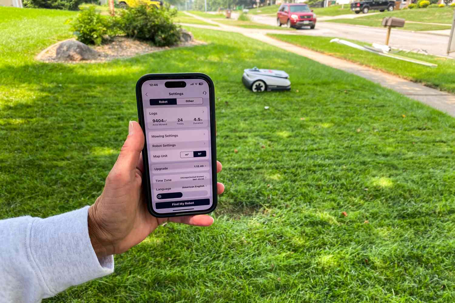 A person controls the Ecovacs Goat A3000 LiDAR Robot Lawn Mower with their smartphone