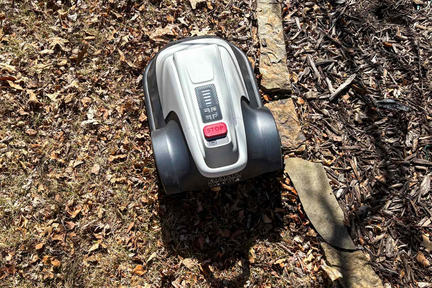 The Eufy Robot Lawn Mower E15 on dirt