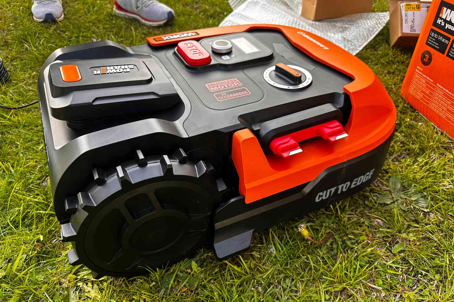 A view of the WORX WR147 Landroid Robotic Lawn Mower from the side