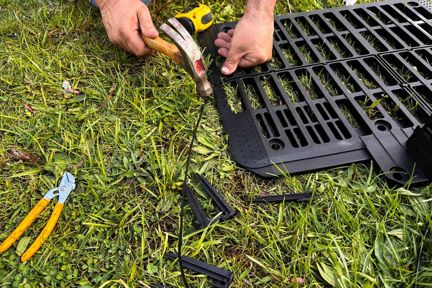 A person assembles the WORX WR147 Landroid Robotic Lawn Mower