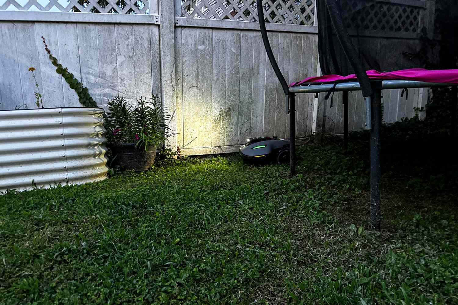 The MAMMOTION YUKA mini (H Version) Perimeter Wire-Free Robot Lawn Mower mows along a fence